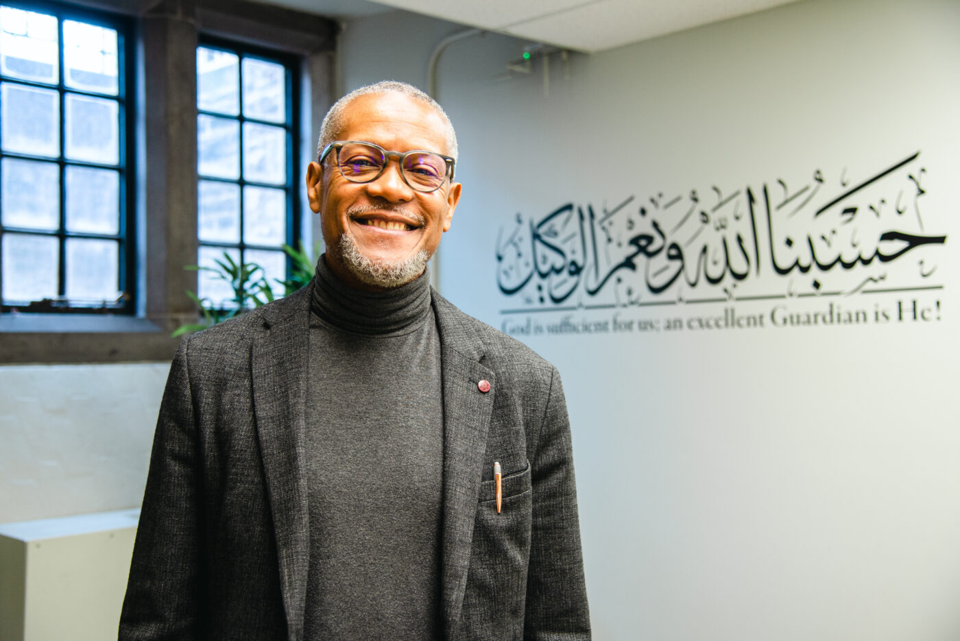 Imam Yasin Dwyer, the voice of Ruh, stands in his chaplaincy office in Emmanuel College on April 20, 2023.