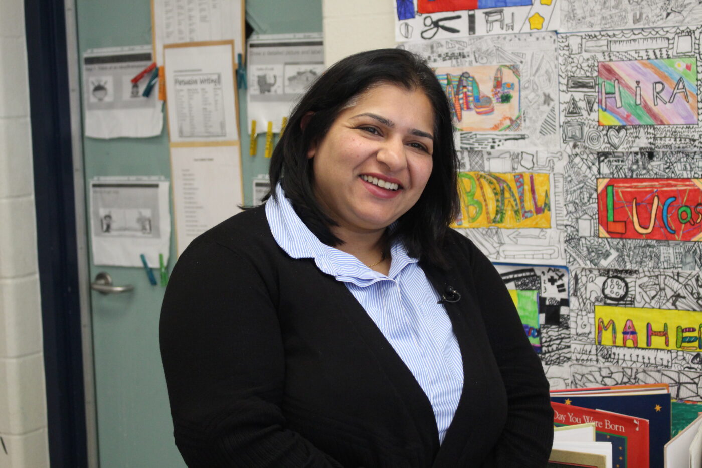 Swati Bhumri, a teacher at Kingsview Village Jr. Public School, stands inside her classroom during the program on robots and AI.