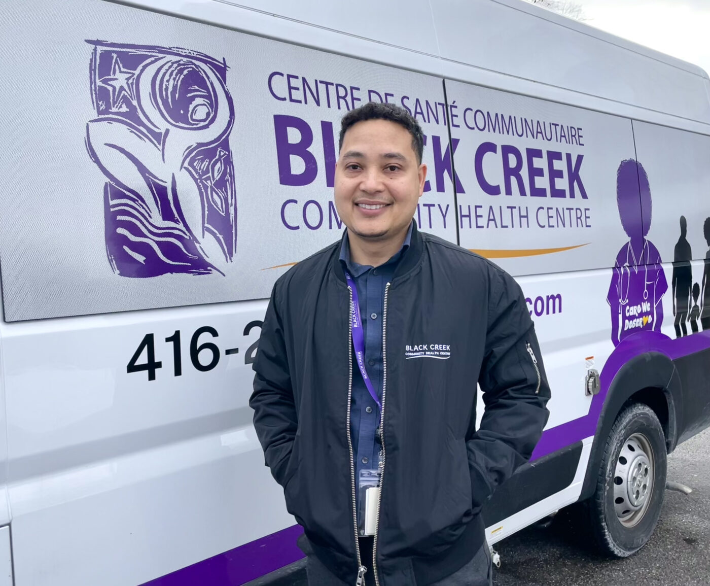 Dr. Mar Lyn stands by the Black Creek Health Centre's mobile healthcare unit.