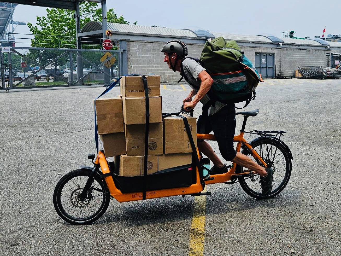 Volunteer cyclist Chad Mohr with The Bike Brigade delivering food and essentials to vulnerable Torontonians. 