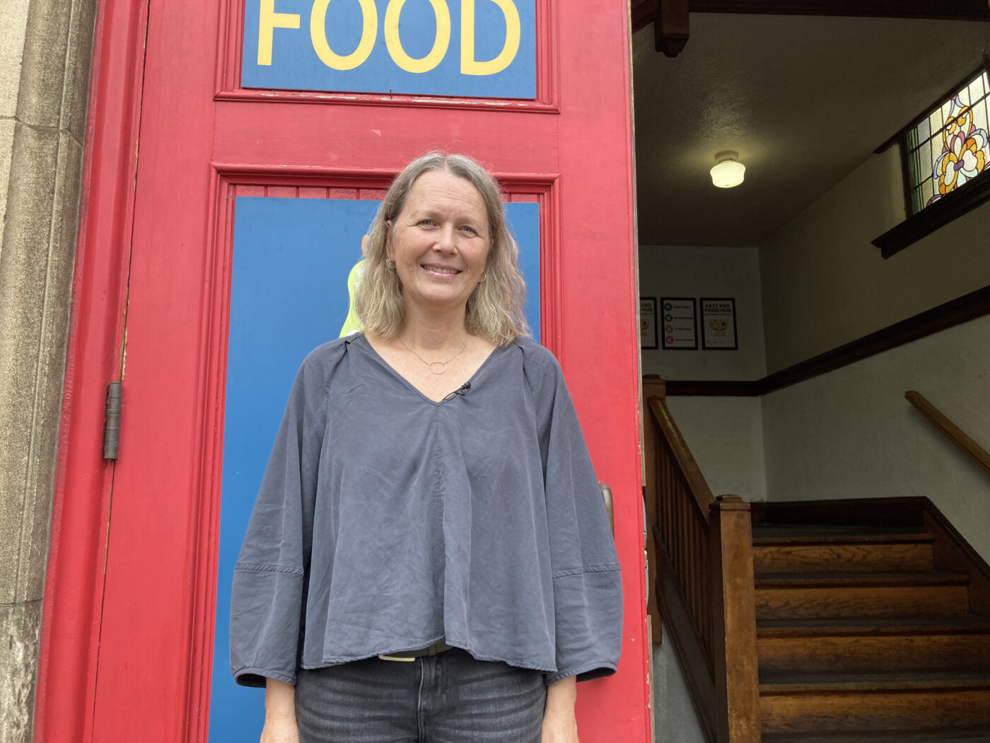 Susanne Burkhardt, executive director of East End Food Hub, stands outside the building supporting local entrepreneurs.