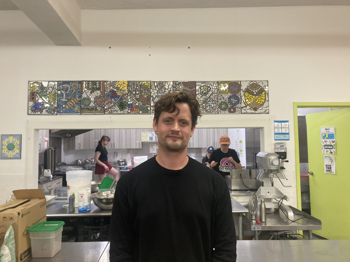 Daniel Taylor, executive director of the Neighbourhood Food Project, stands inside LFM Basecamp's kitchen supporting local entrepreneurs.