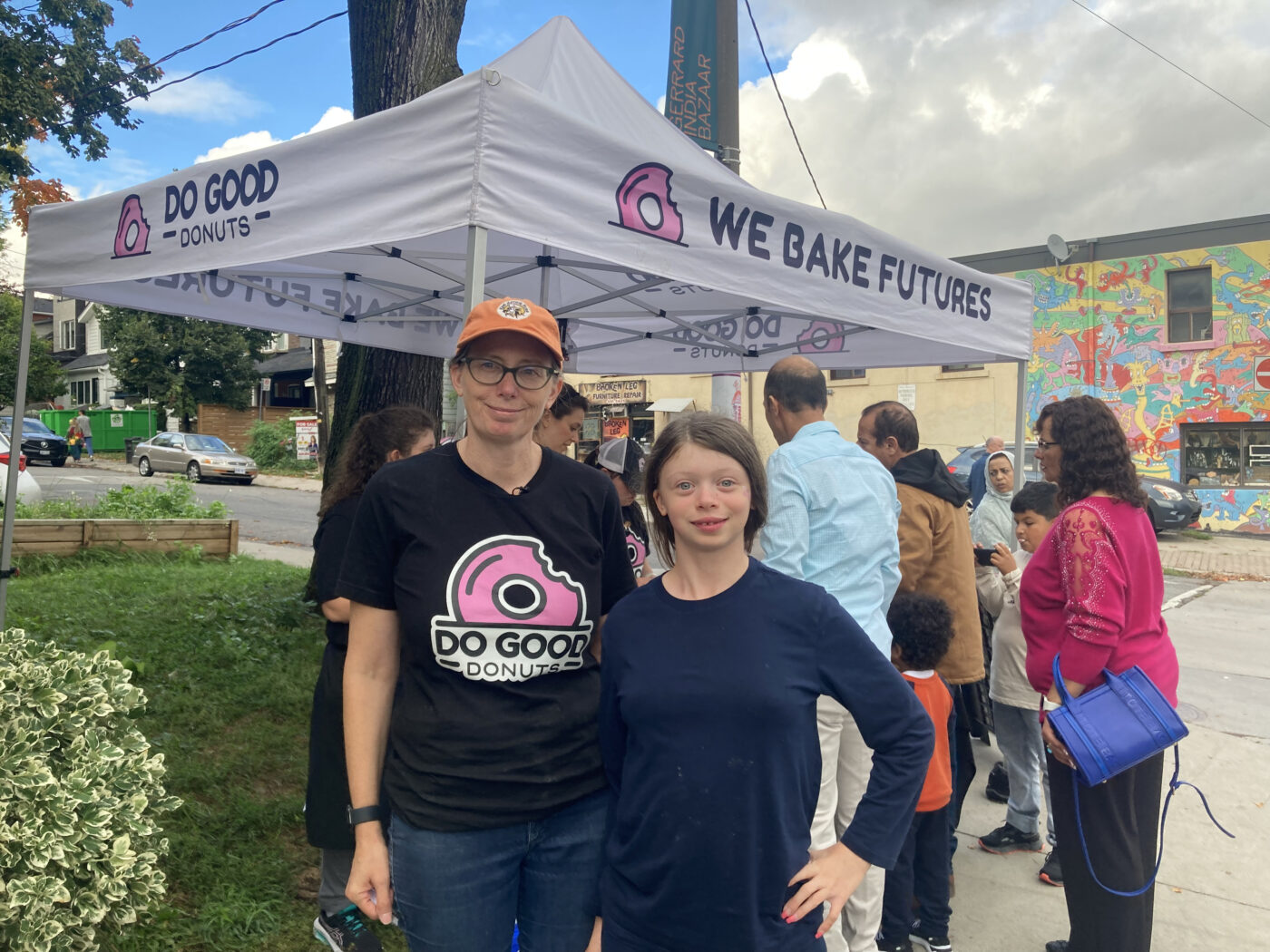 Local entrepreneur, Melanie Côté, stands with her daughter by their pop-up stand.