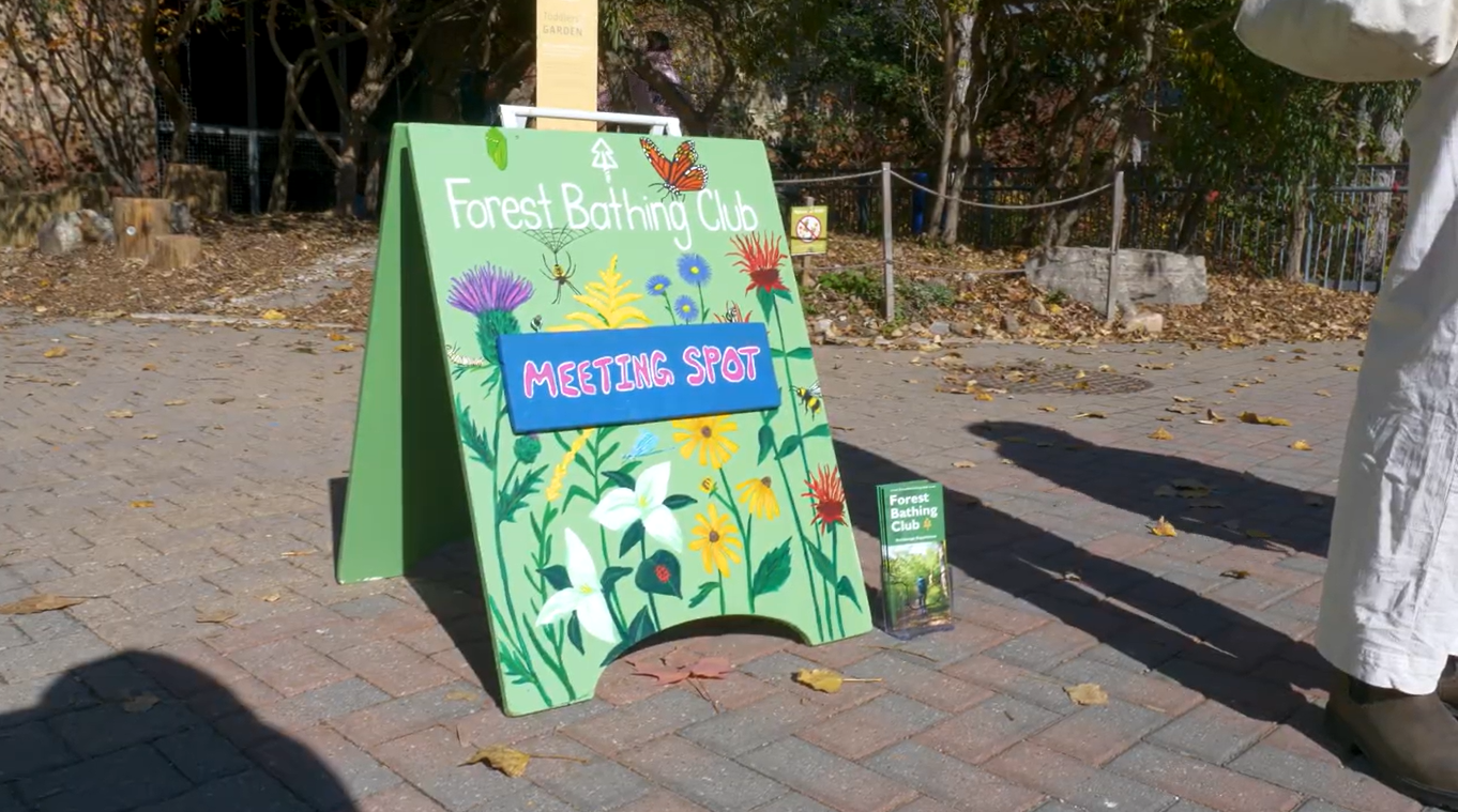 The Forest Bathing Club sign inviting people to join at Evergreen Brick Works.