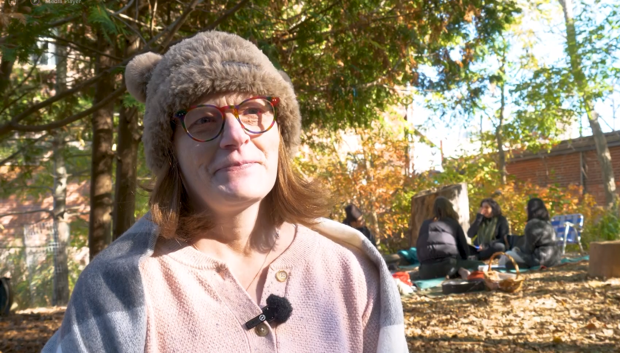 Janet Restrup, participant in forest bathing club, stand by the group.