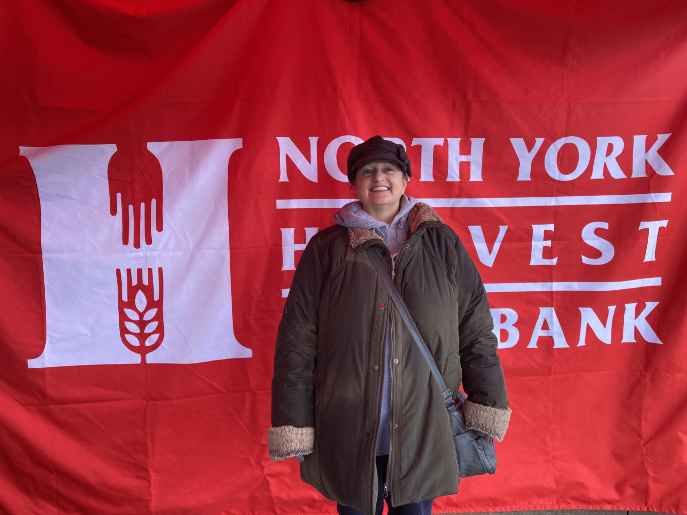 Katy Chiappetta in front of North York Harvest Food Bank's tent.