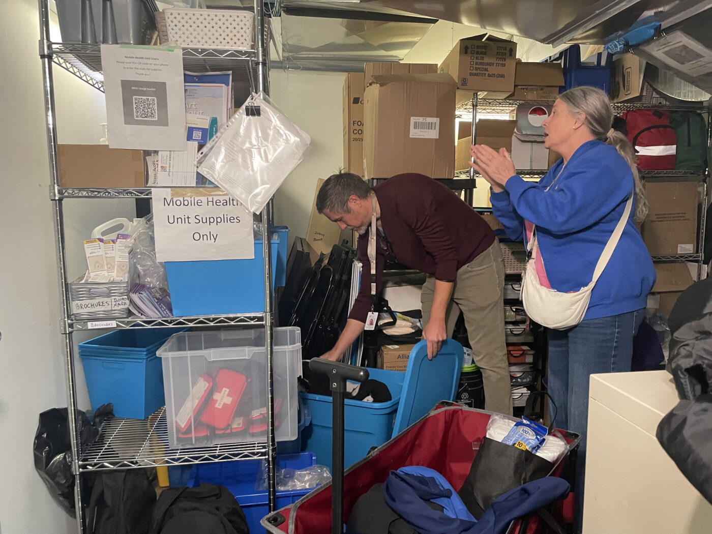 Mobile health unit team collect supplies for weekly visit.