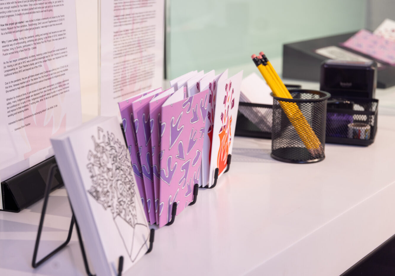 Cards with graphic drawings on them on display as part of Write to Me by Vanessa Dion Fletcher.