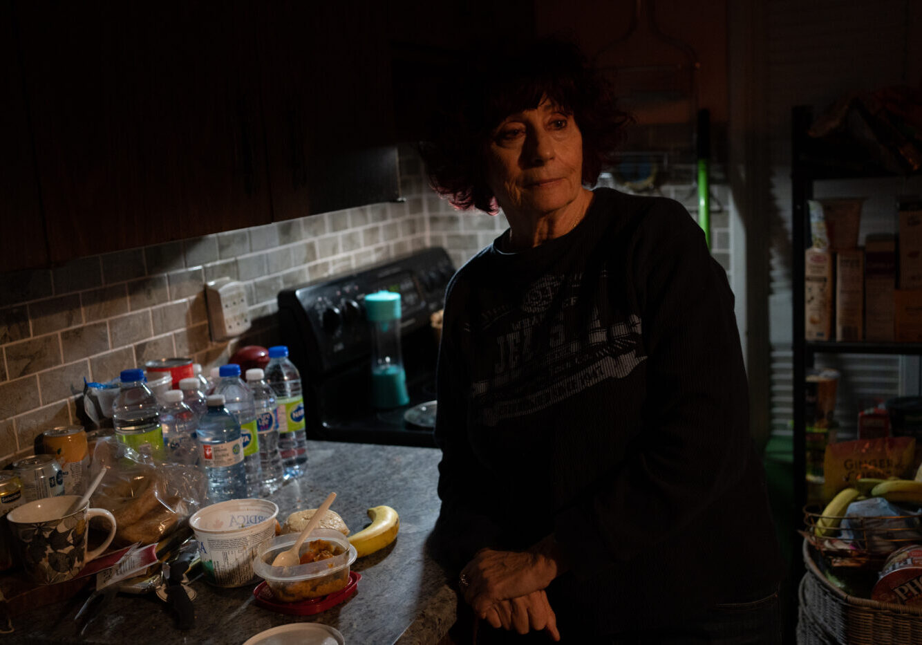 Goldie Wallensky eats dinner which consists of leftovers from a community dinner program earlier in the week in North York, Canada, on January 15, 2025. Goldie a vegitarian says "it can be hard to find food for our diets from food banks or community meal programs."