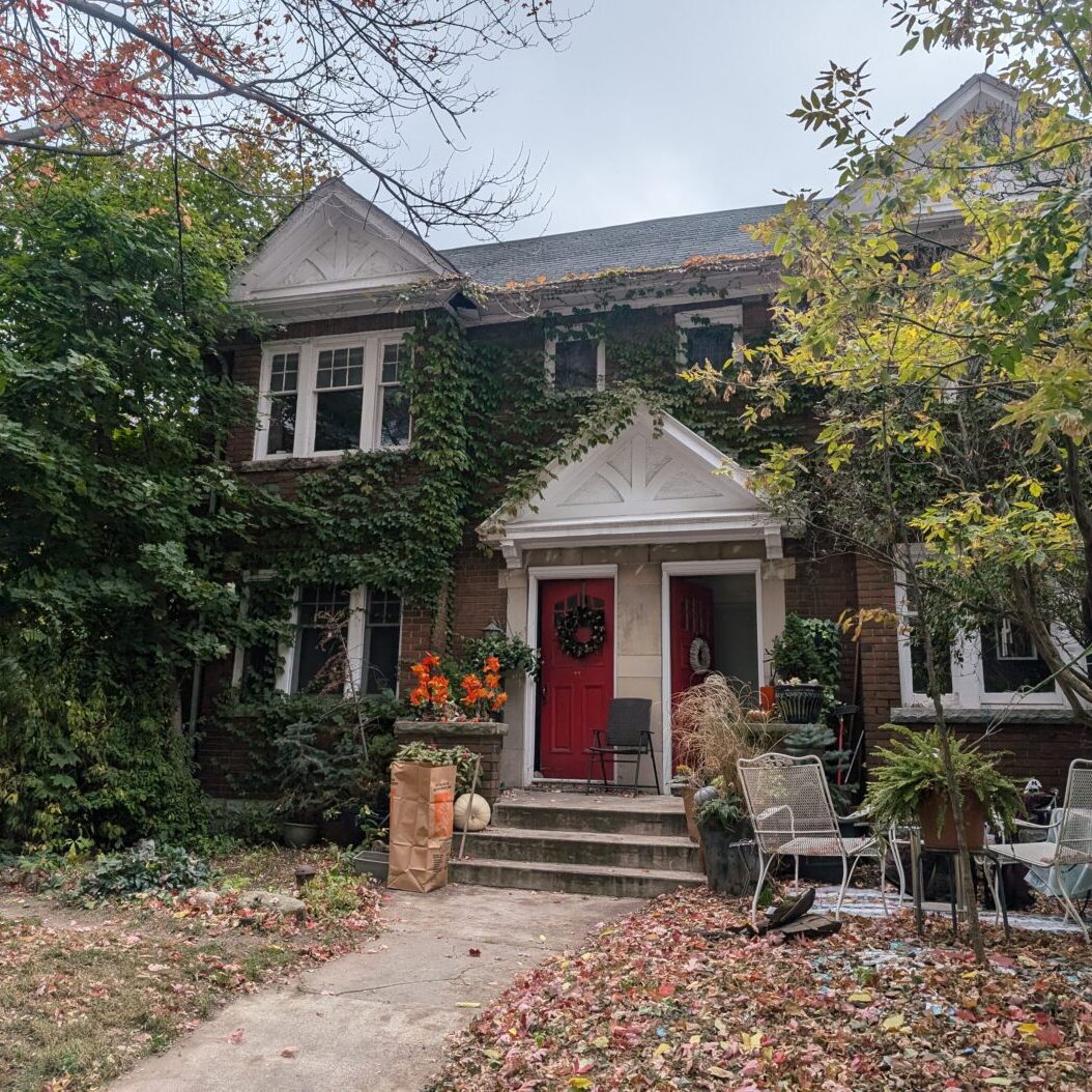 A family house with a red Door.