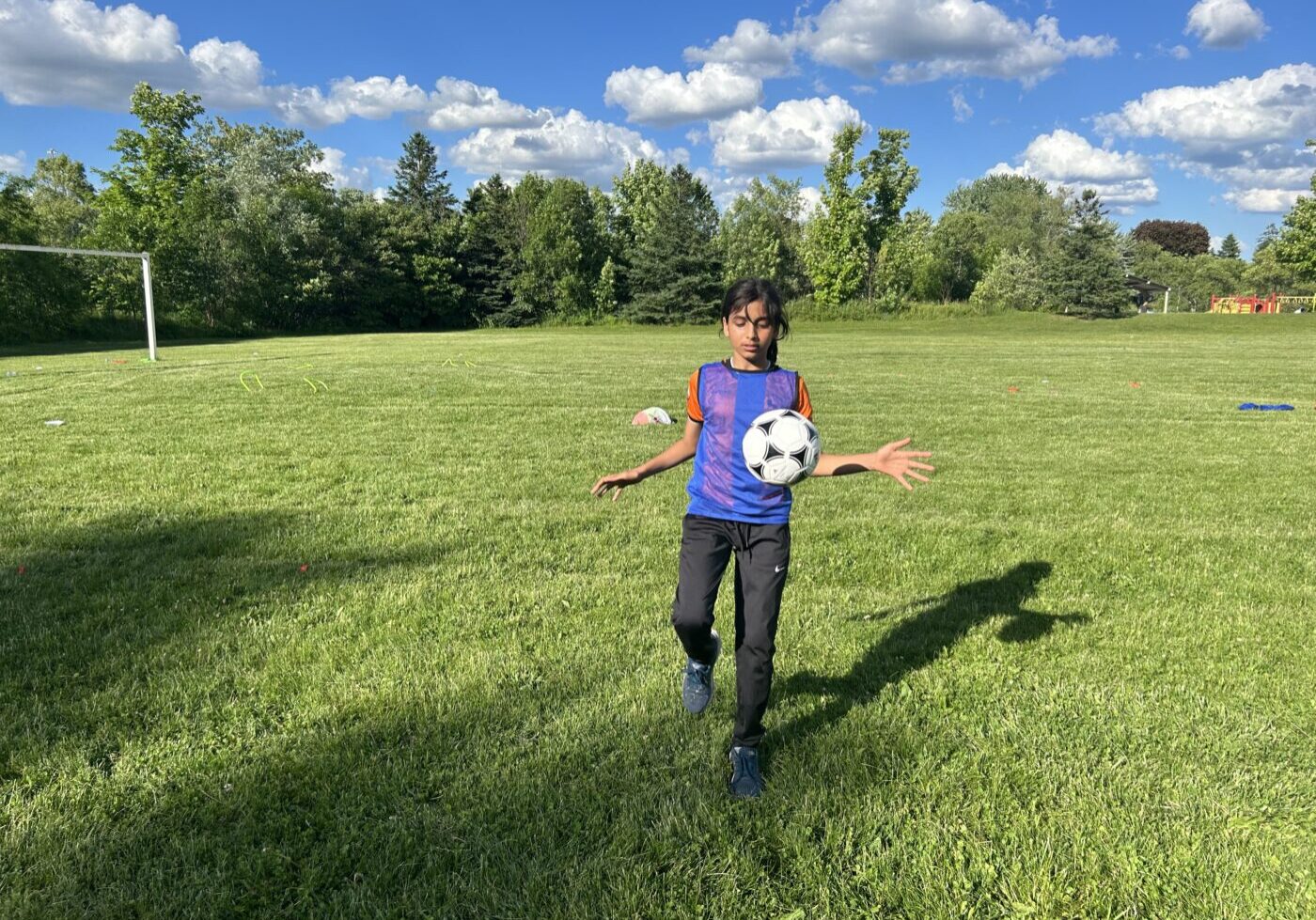 Elesar Aljawabrih, Scarborough Simbas participant, plays soccer at Terraview Park.