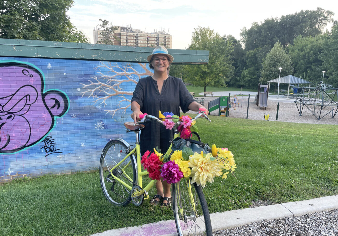 Alison Stewart stands with her bike after finishing a Black history walking tour.