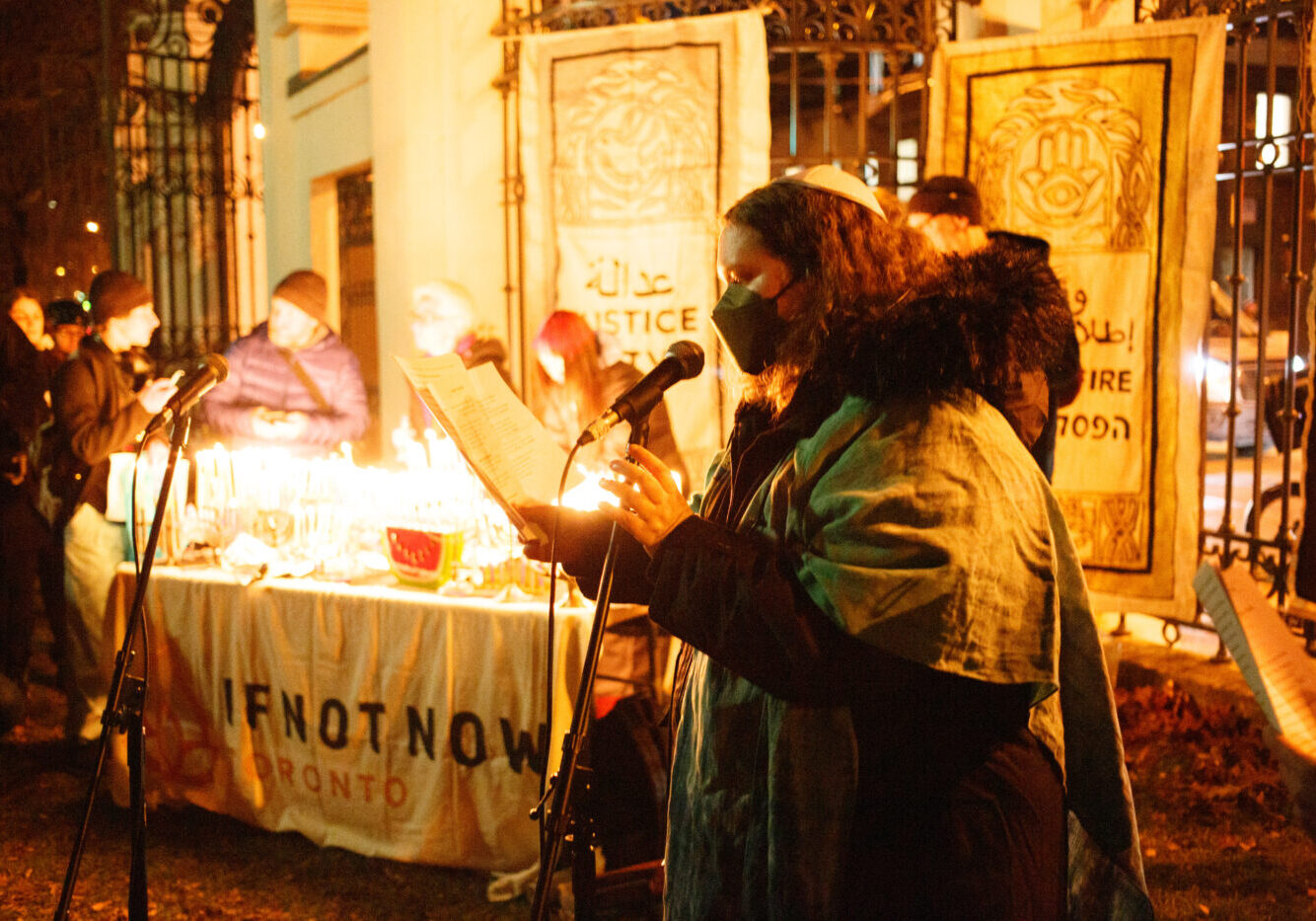 On December 14, 2023, IfNotNow Toronto came together with over 300 community members to light candles for Chanukah, prayed for Palestinians who were injured, displaced, or held captive by Israel, and for the Israeli hostages in Gaza.