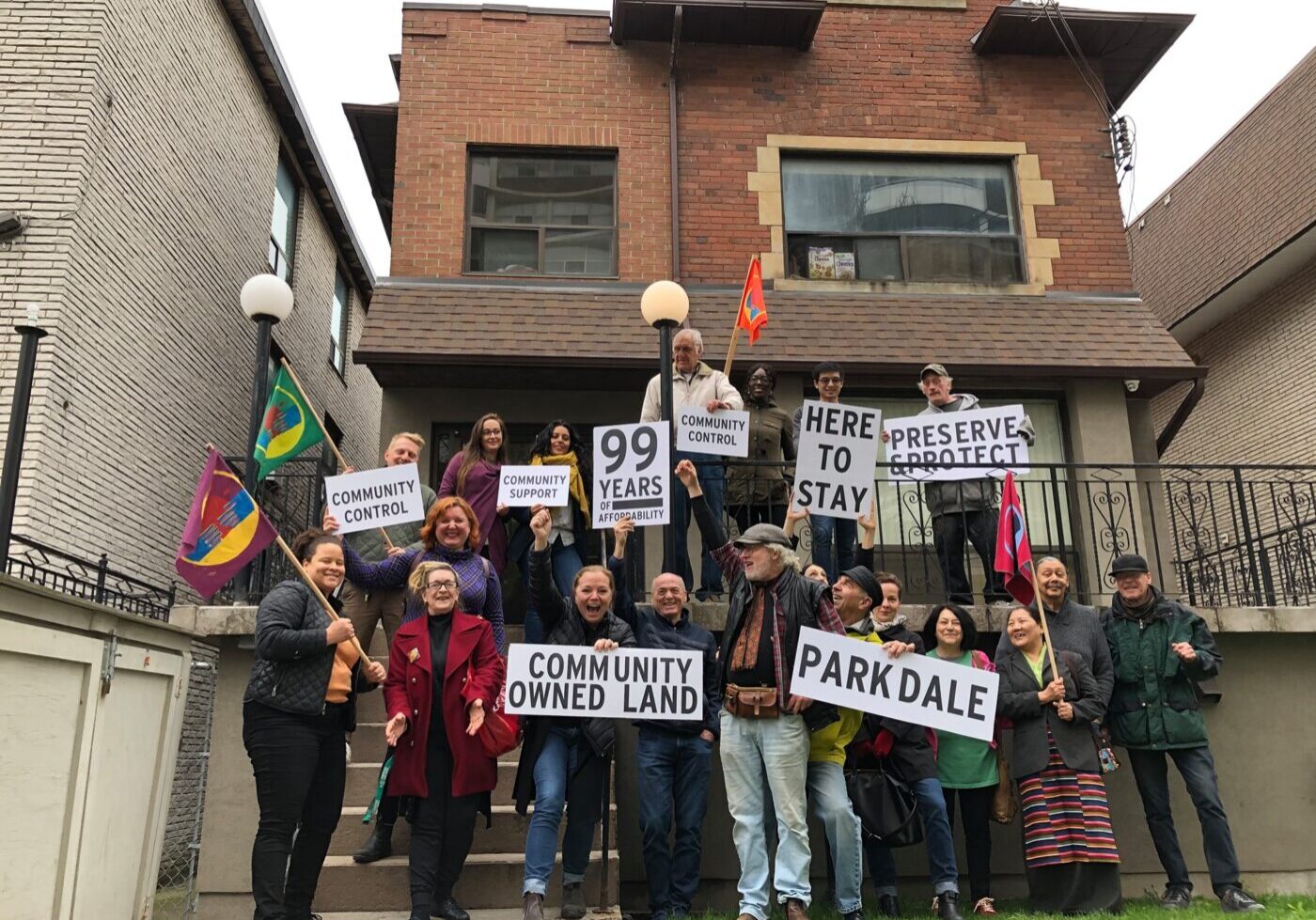 Parkdale residents celebrate the acquisition of 26 Maynard Avenue.